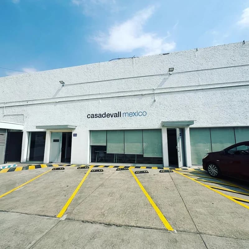 The Casadevall Mexico plant, a white single-storey building with its name above the entrance.