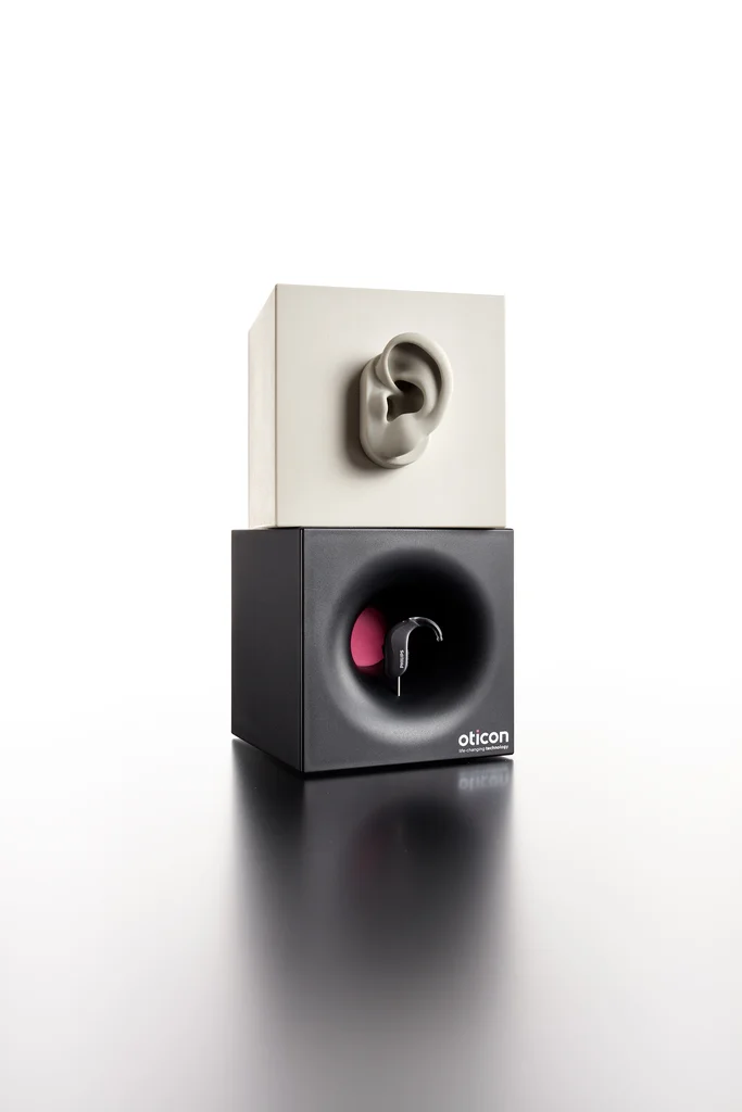 Oticon: Hearing device product display produced by Casadevall Group.