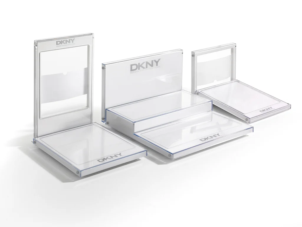 DKNY: Three-piece acrylic countertop riser produced by Casadevall Group.
